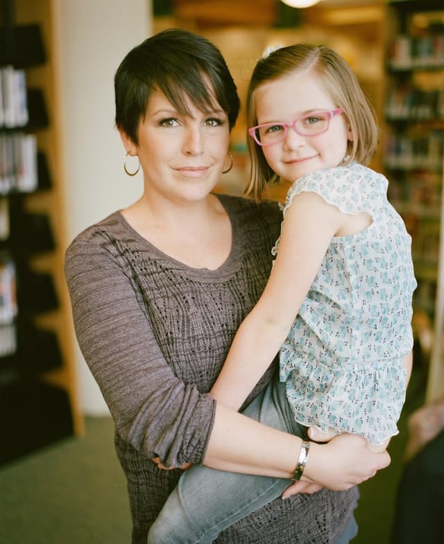 Parent carrying student